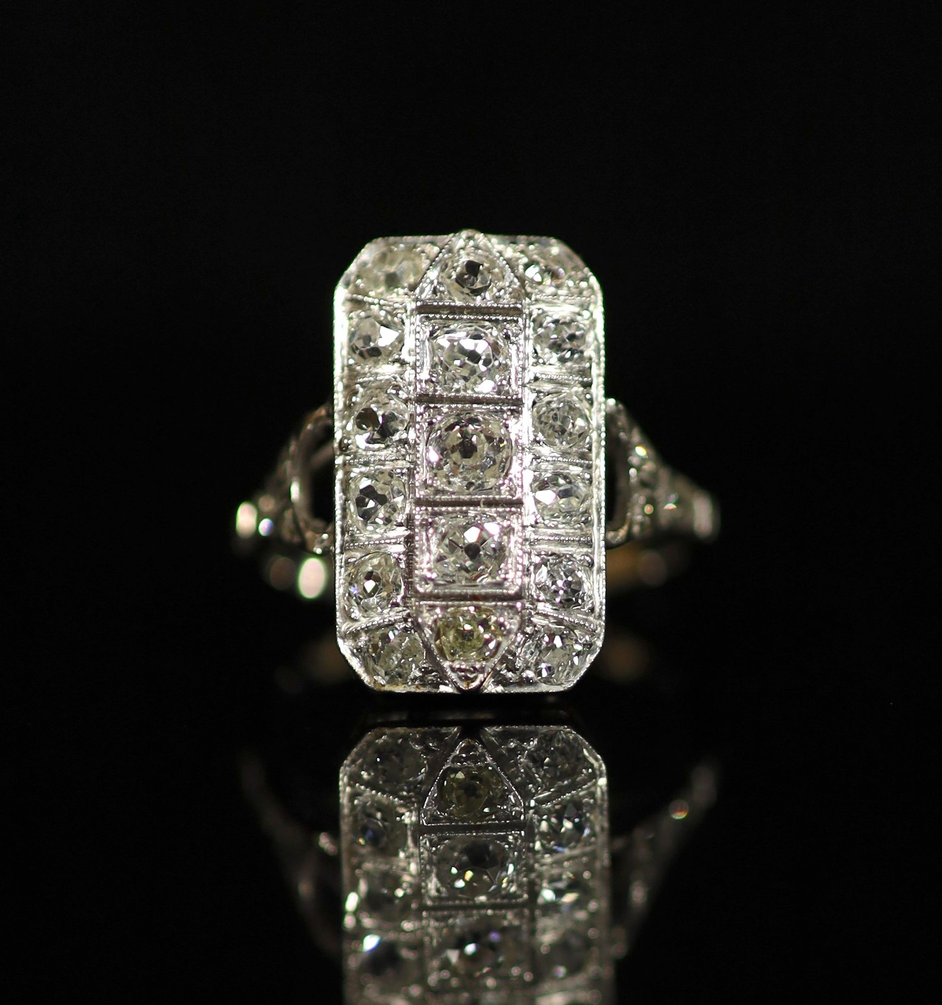 A 1930's/1940's white gold? and diamond cluster tablet ring